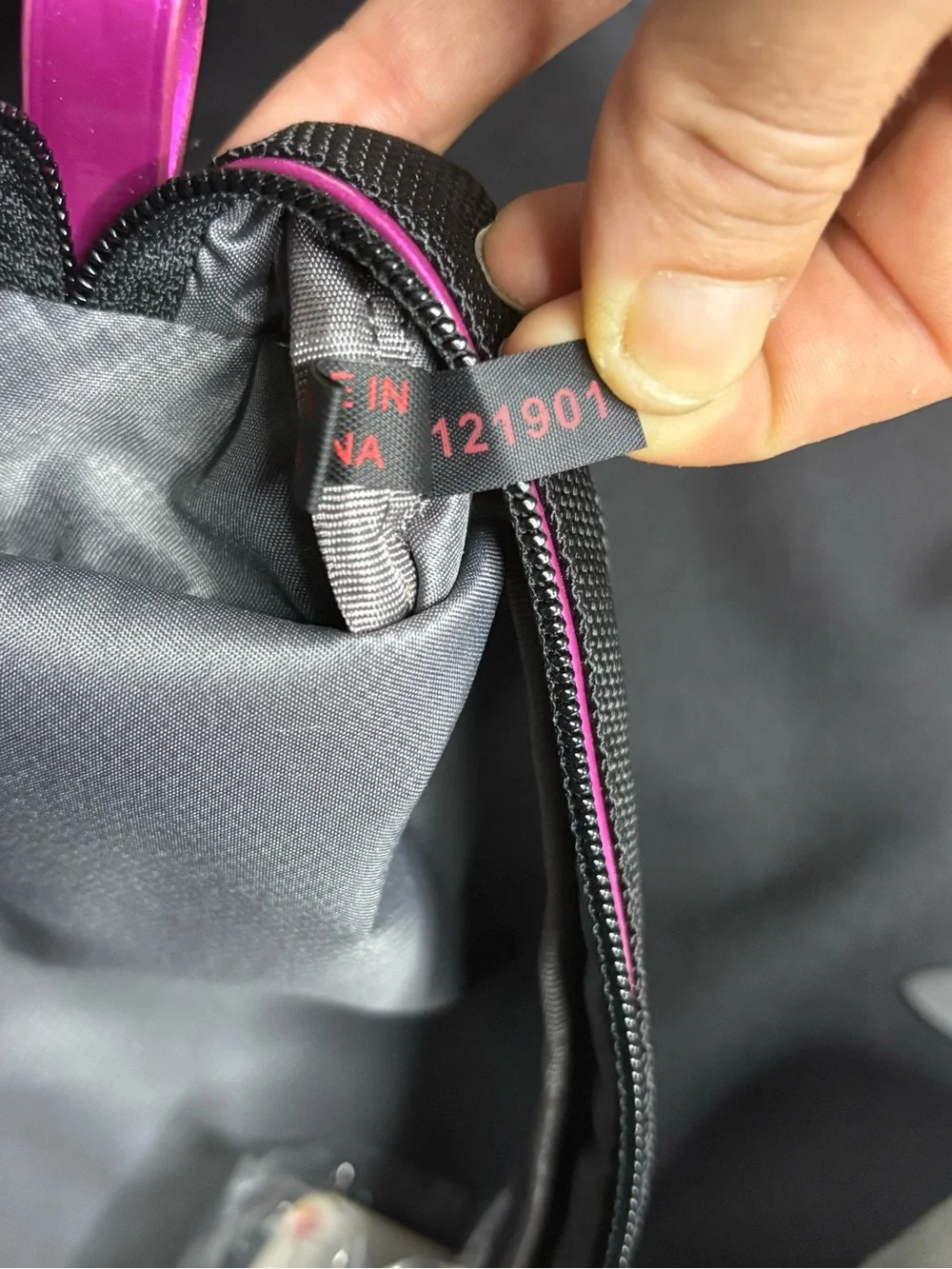 Tumi Black Travel Pouch with Pink Accents